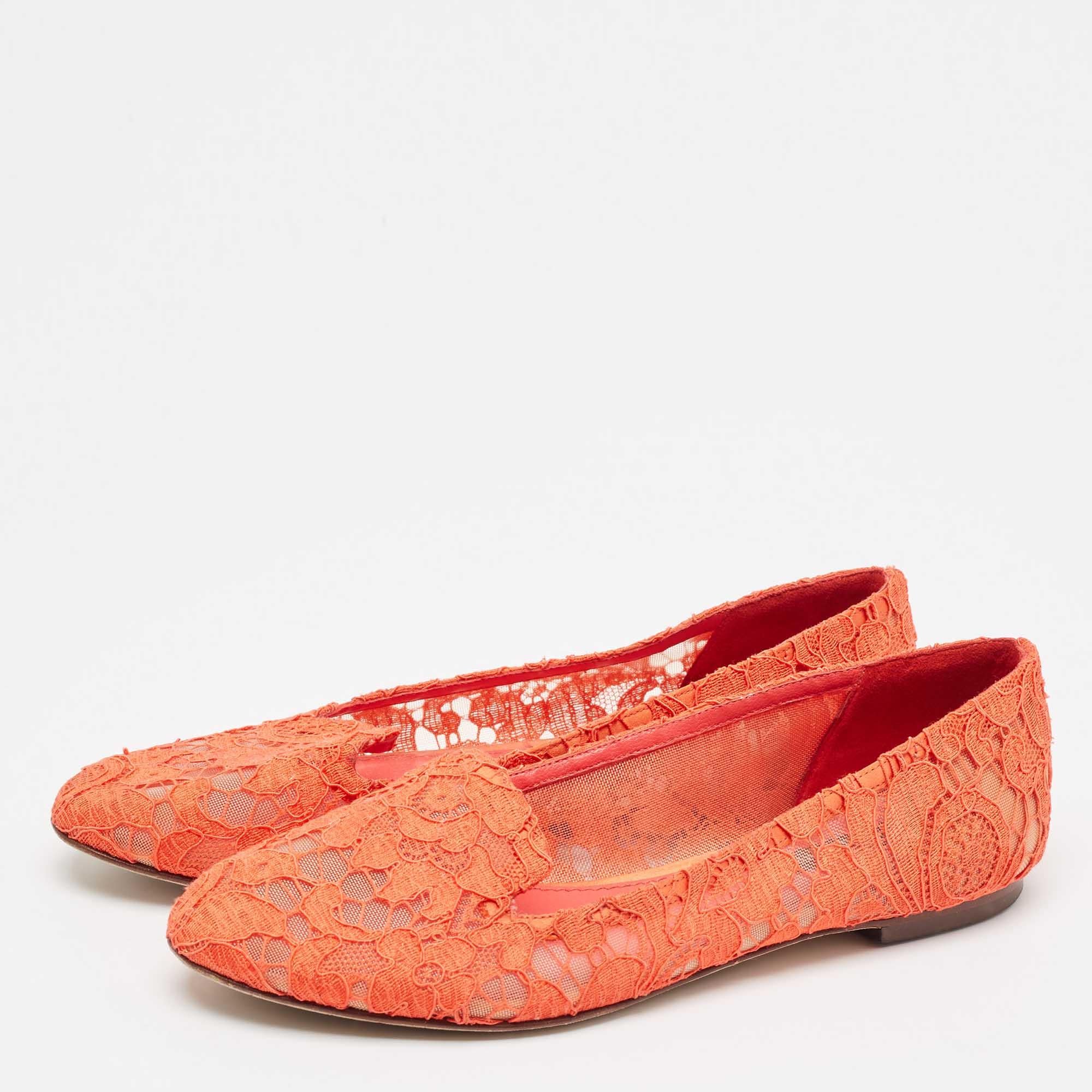 These Dolce and Gabbana smoking slippers are beautiful in orange lace. They are designed to elevate your OOTD and keep you in comfort all day long.