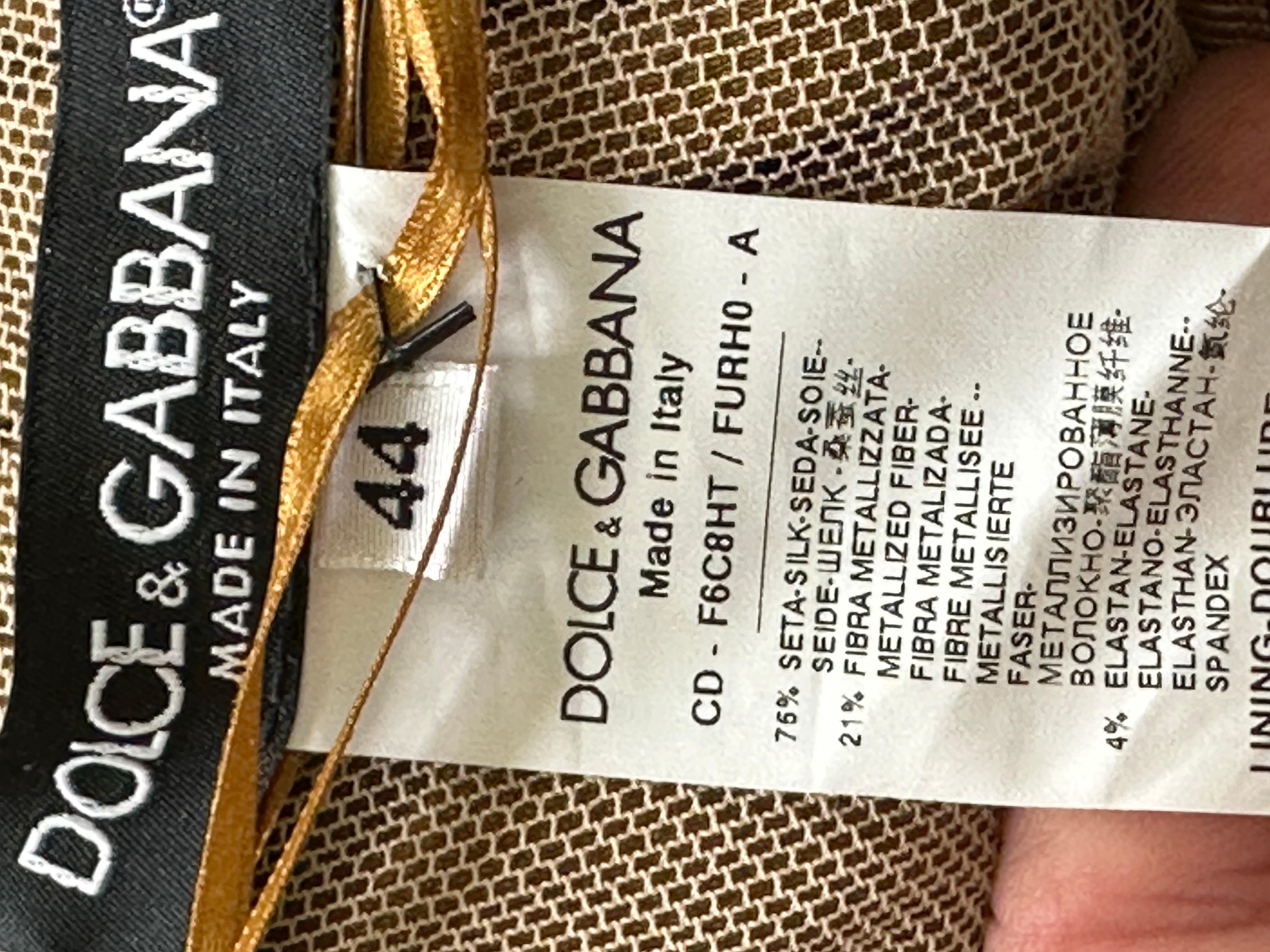 Dolce & Gabbana Stunning Vintage Metallic Gold Ruched Cocktail Dress .
Please use the zoom feature to see the wonderful details.
Size 44, there is a lot of stretch.
76% Silk 24% Metal
 Bust 35