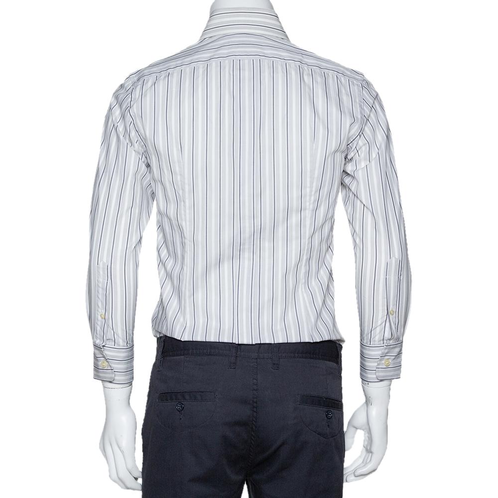 Perfect office wear, this shirt by Dolce & Gabbana is a power statement. It has been crafted from cotton. It comes in a pale grey color and carries a striped exterior. It has long sleeves, button front, a simple collar, and is tailored to offer a