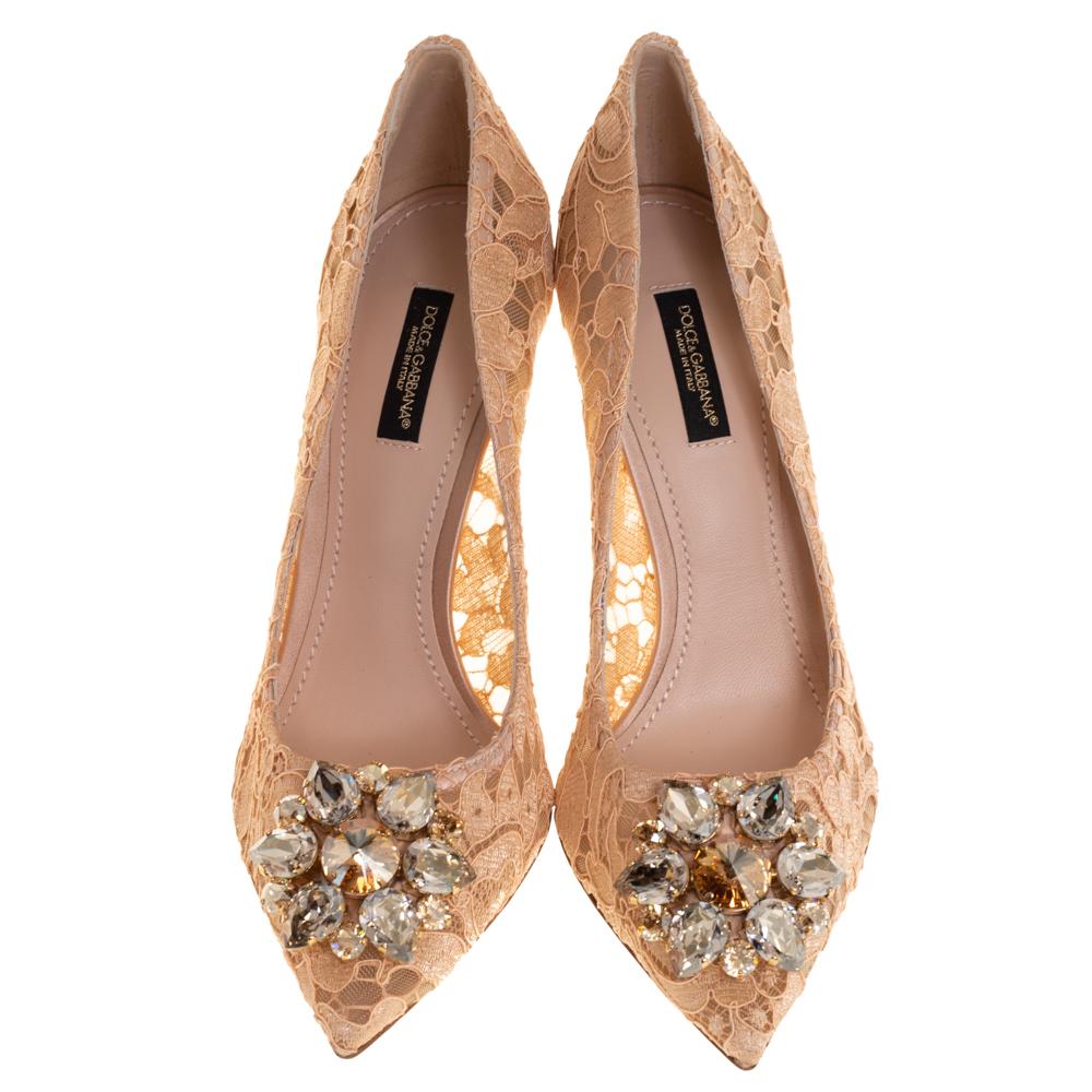 Draped in beautiful floral lace, these peach Dolce & Gabbana pumps are gorgeous! They have been styled with pointed toes and embellished with exquisite crystals. Comfortable leather-lined insoles and 9.5 cm heels complete this pair.

Includes: