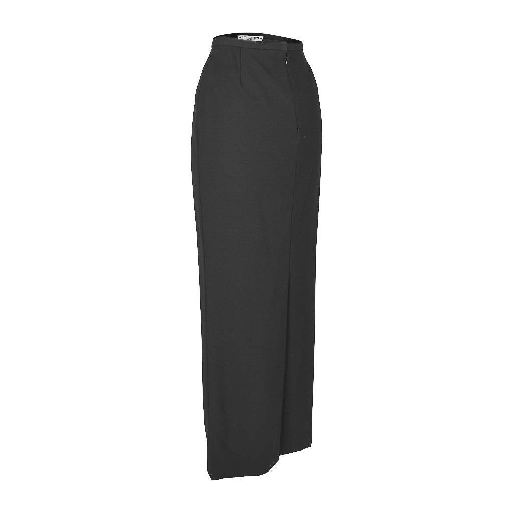 Dolce&Gabbana long black ankle length pencil skirt.
Classic and timeless.
Skirt is smooth all around.
A pleat at rear.
Hidden rear zip.
Fabric is acetate and nylon.
final sale

SIZE 38
USA SIZE 4

SKIRT MEASURES:
LENGTH 40.25