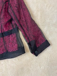 Dolce & Gabbana pink and black lace blazer.