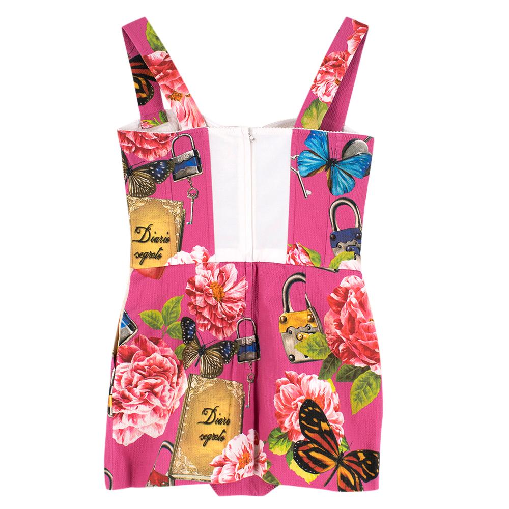 Dolce & Gabbana Pink Corseted Floral Playsuit

Orange buttons 
Thick shoulder straps
Pleated skirt detailing 
Scallop detailing on the top of the dress
Built in Body 
Interior lining 
Silver hardware
Single zip fastening on back of the dress
Two
