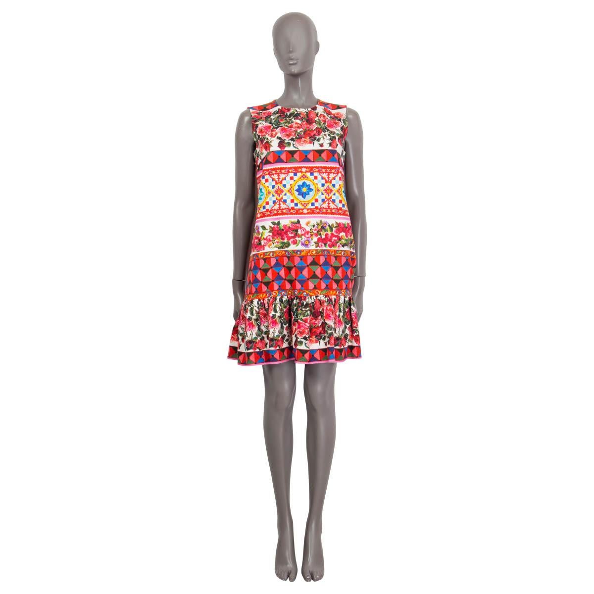 100% authentic Dolce & Gabbana Spring/Summer 2017 sleeveless dress in pink, green, blue, yellow, white and turquoise cotton (99%) and elastane (1%). Has a mambo print featuring maiolica and rose pattern. Features ruffled details at the hemline.