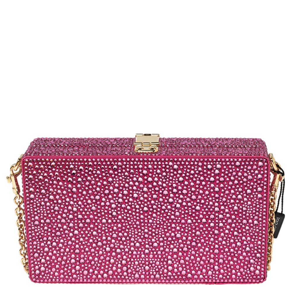 This luxurious and stylish Box bag from Dolce & Gabbana is a treat to the eyes! The brand offers you a bag that has been crafted from pink satin and decorated with crystal embellishments. A polished gold-tone turn-lock padlock with a daisy secures