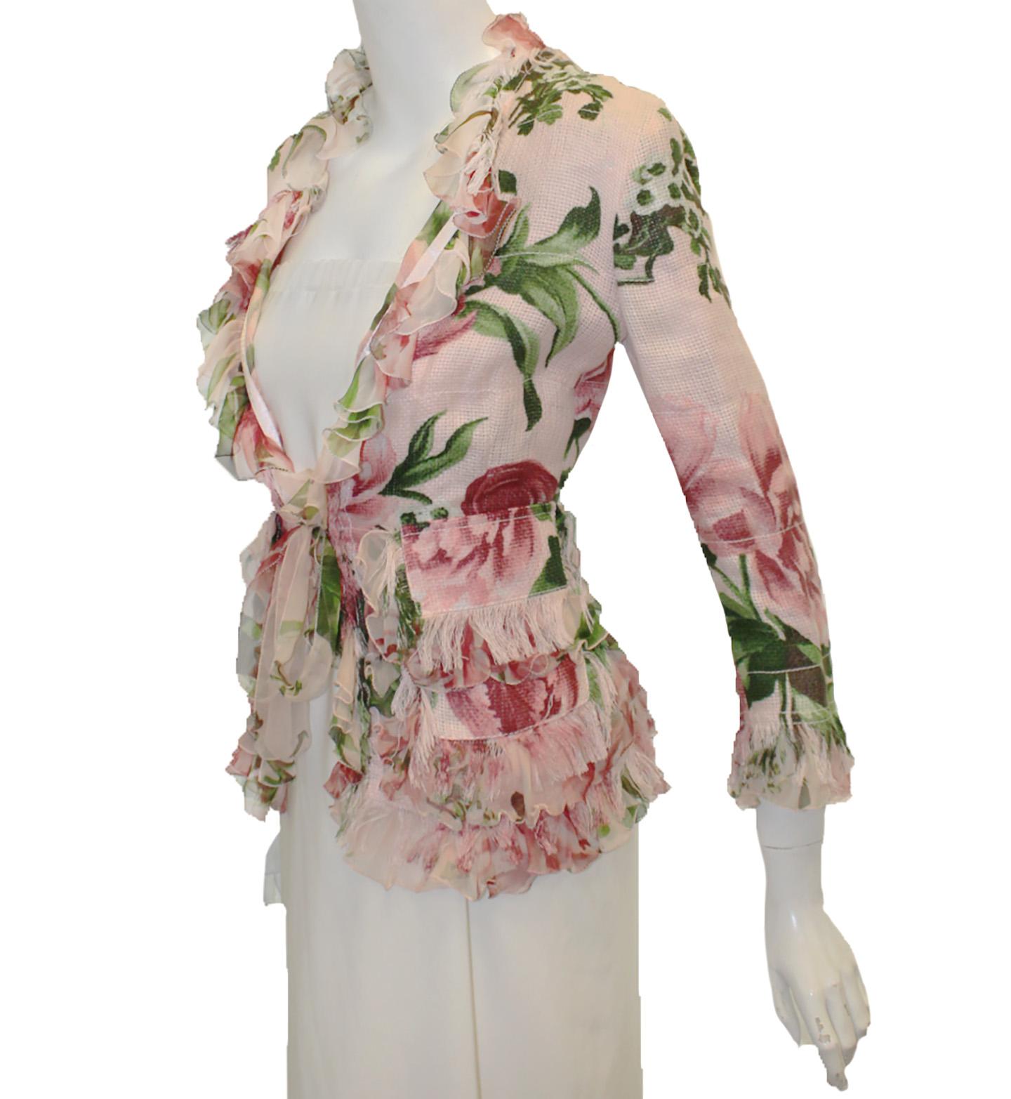 Dolce & Gabbana pink floral jacket taking their stylistic source, they also make everybody look like stars. You will be lounging in luxury wearing this pink silk floral printed jacket featuring a silk chiffon ruffle, also, in floral print and fringe
