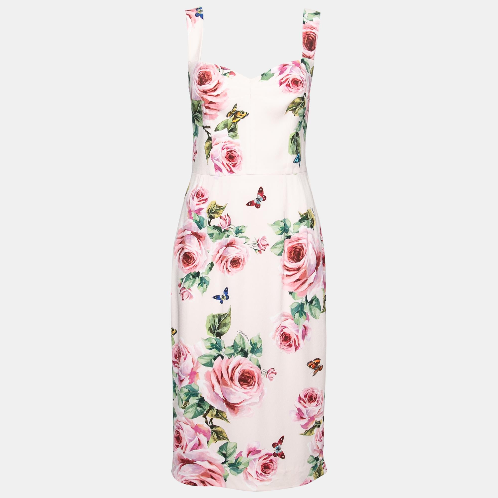 Quality fabrics blended with attractive designs are a specialty of Dolce & Gabbana. And this dress is no different. Graced with beautiful floral prints, this pink dress brings a colorful spring feel to your wardrobe. It is sleeveless and has a