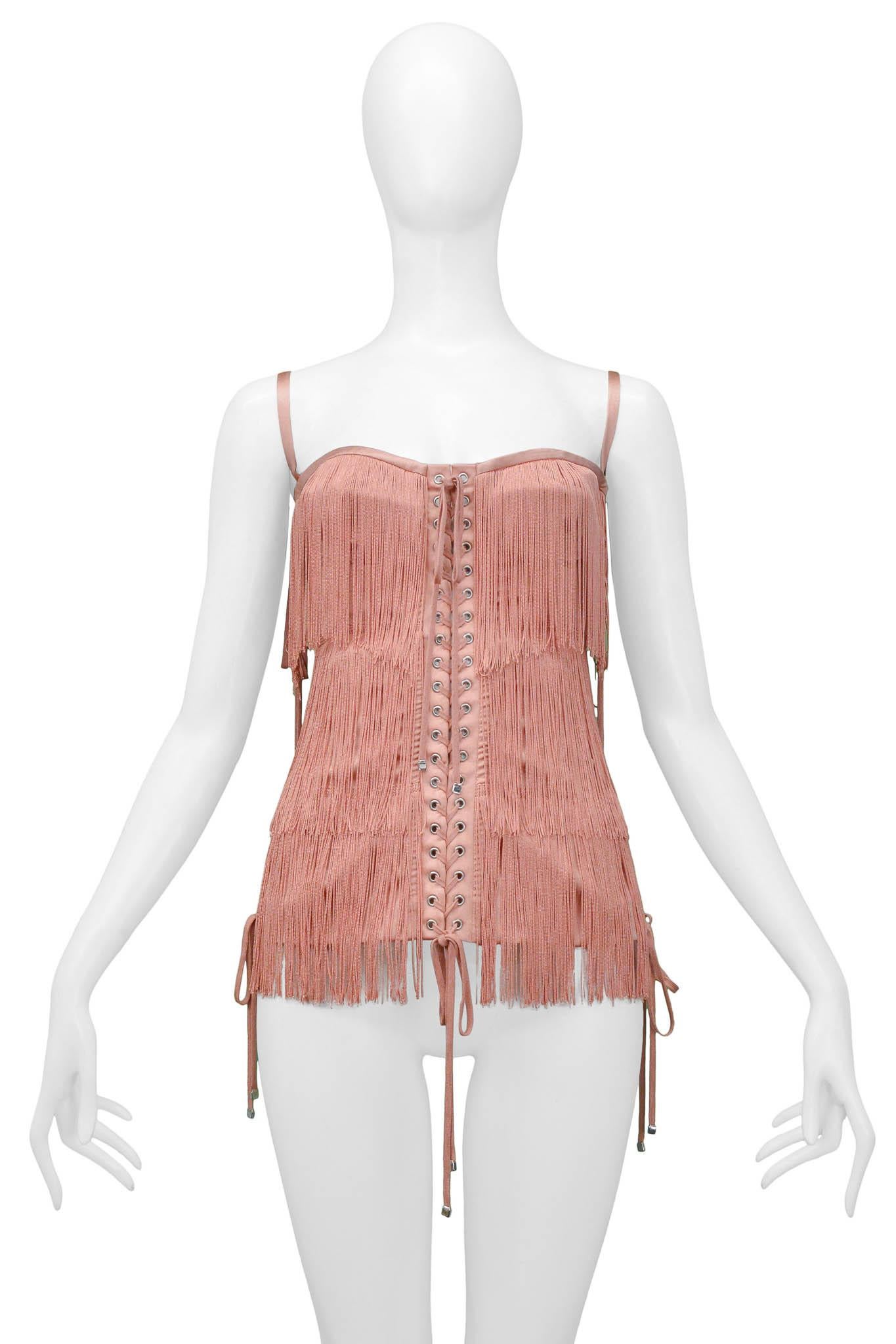 Resurrection Vintage is excited to offer a vintage Dolce & Gabbana pink fringe corset top featuring fringe all around the front and back of the garment, lace-up panels along the front, back, side seams, and a hidden zipper at the side seam.

Dolce &