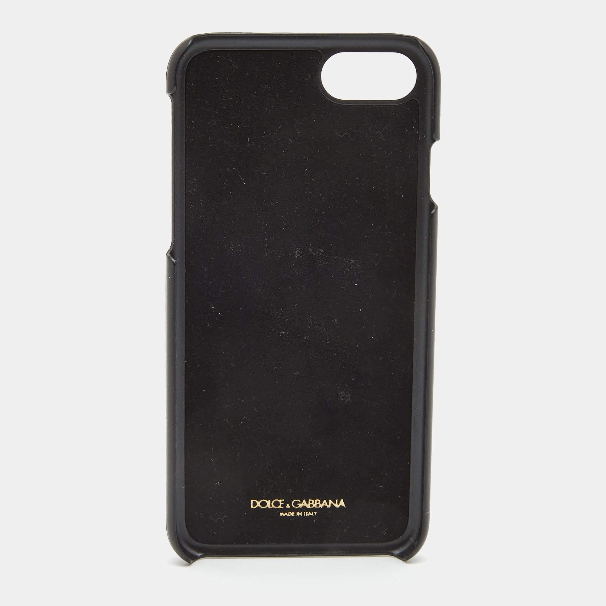 Keep your iPhone 7 safe and stylish in this cover from the House of Dolce and Gabbana. It is made from multicolored leather  with crystal embellishments and Pineapple prints elevating its beauty. It has an Alcantara lining and gold tone hardware.