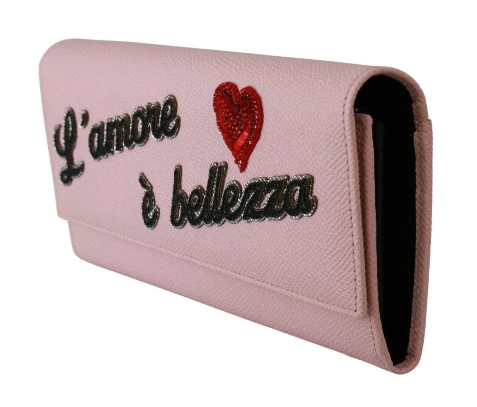 Gorgeous brand new with tags, 100% Authentic Dolce & Gabbana wallet.




Model: Continental wallet bifold clutch
Material: 100% Leather
Color: Pink, gold metal detailing
Motive: L'amore e' bellezza
Black inner lining
Cardholder slots and coin