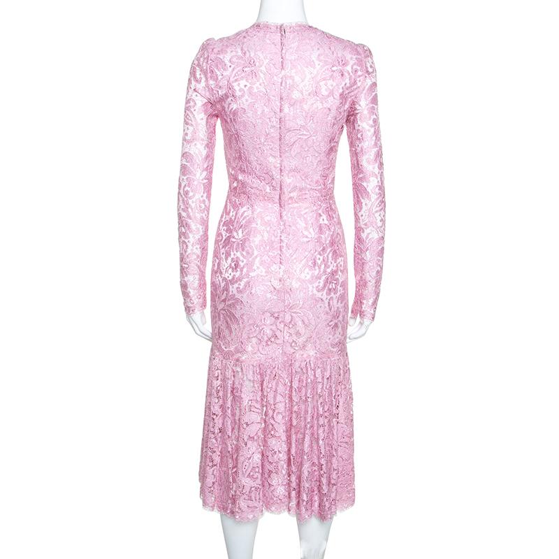 In a perfect blend of modern style and feminity, this Dolce & Gabbana dress is a creation for the chic woman. It comes in pink with a lovely lace overlay, long sleeves and zip closure. The dress is a winner with high heels.

