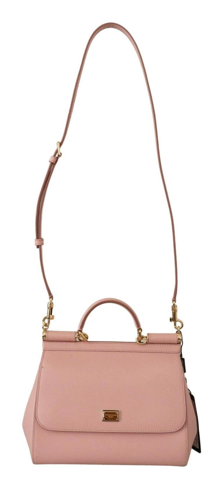 Gorgeous brand new with tags, 100% Authentic Dolce & Gabbana Women's Bag.

Model: SICILY

Material: 100% Leather

Color: Pink with gold metal detailing

Strap: One handle, detachable and adjustable shoulder strap

Magnetic flap closure

One inside