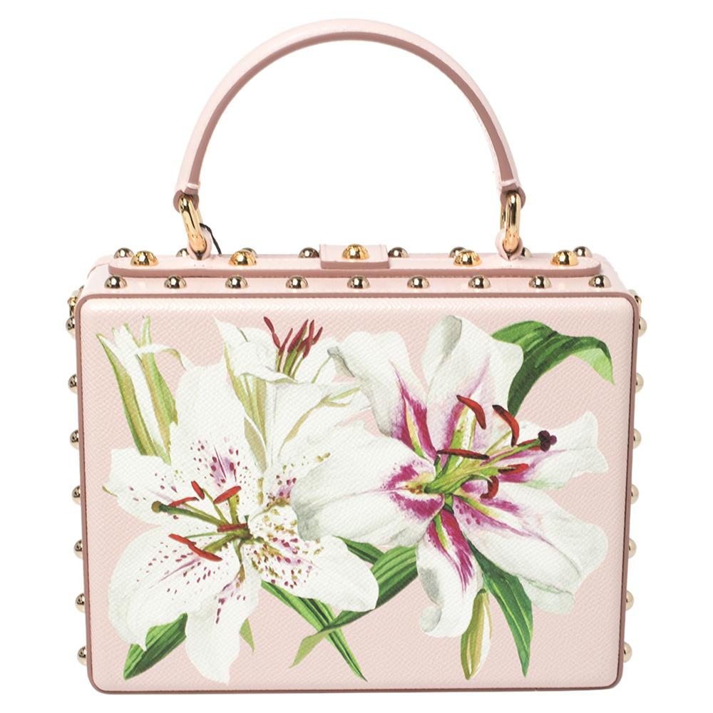 Dolce & Gabbana’s penchant for flowers is exemplified by the intricate lilies adorning this ultra-feminine Dolce Box bag. It’s adorned by gold-tone metal studs on the top, which coordinate with the logo-engraved padlock fastening and is embellished