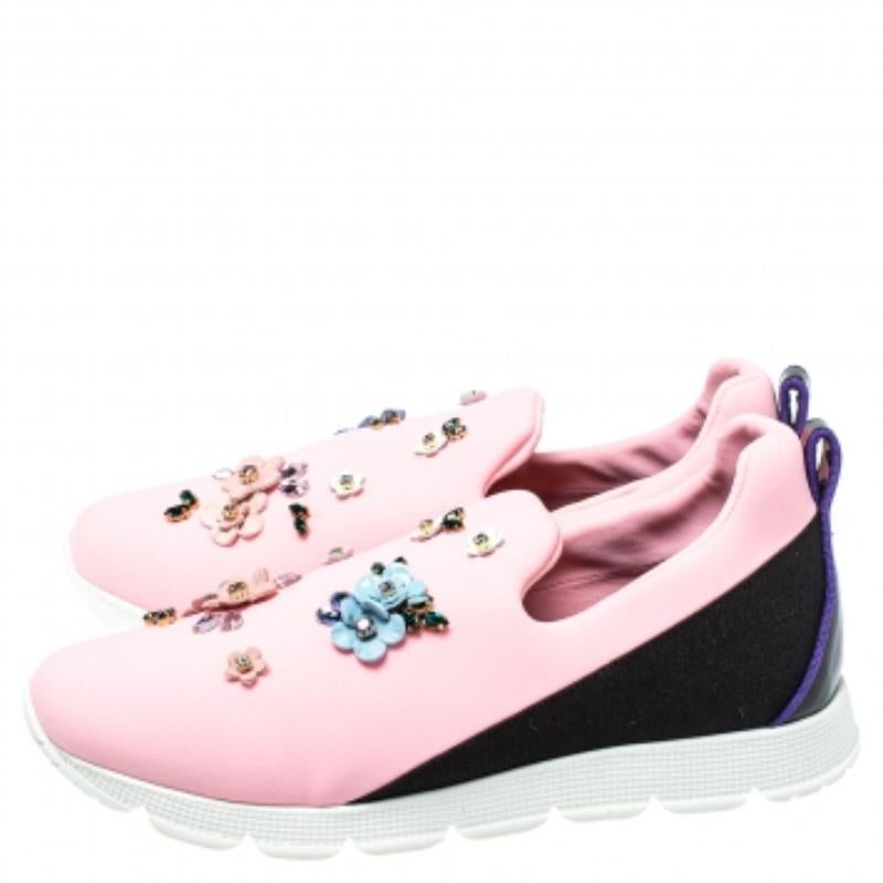 Fabulously designed to stand out and grab you compliments, these slip-on sneakers from Dolce & Gabbana deserve a special place in your wardrobe! Shining bright in pink, these sneakers are crafted from neoprene and feature round toes, exquisitely