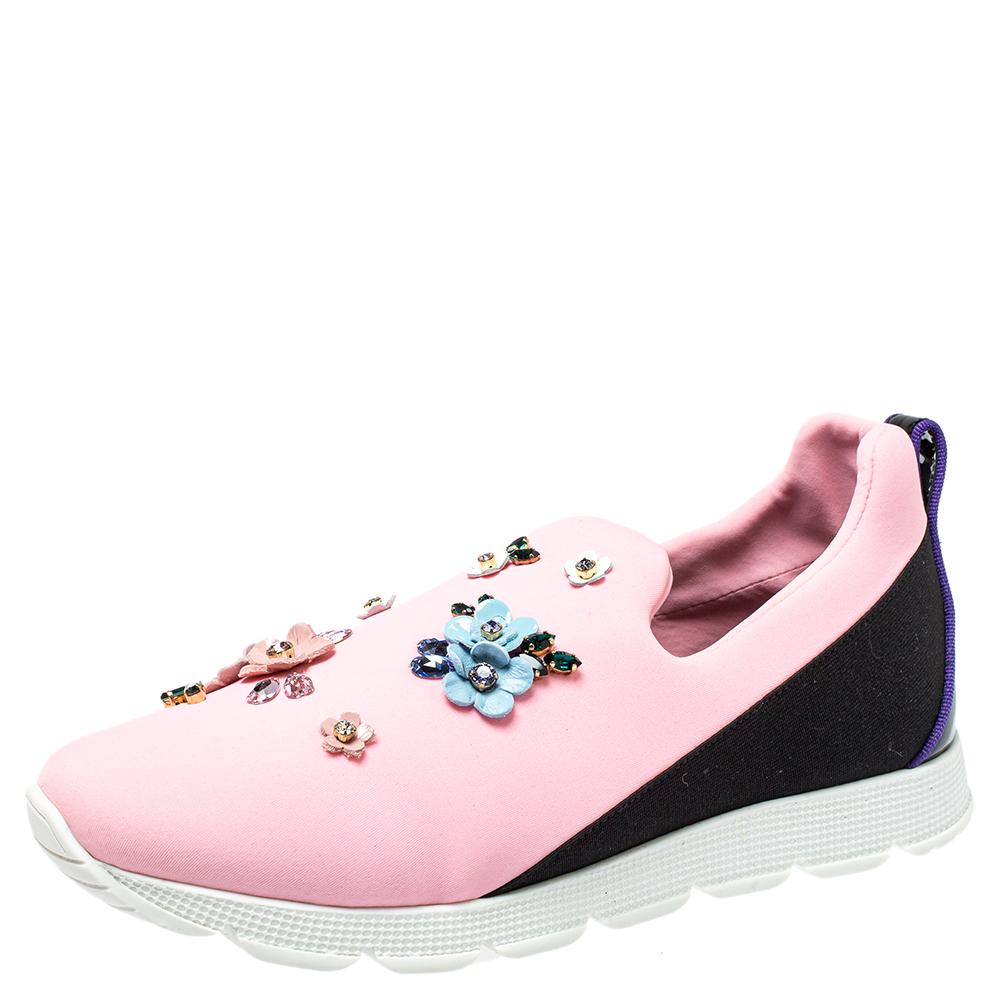 Fabulously designed to stand out and grab you compliments, these slip-on sneakers from Dolce & Gabbana deserve a special place in your wardrobe! Shining bright in pink, these sneakers are crafted from neoprene and feature round toes, exquisitely