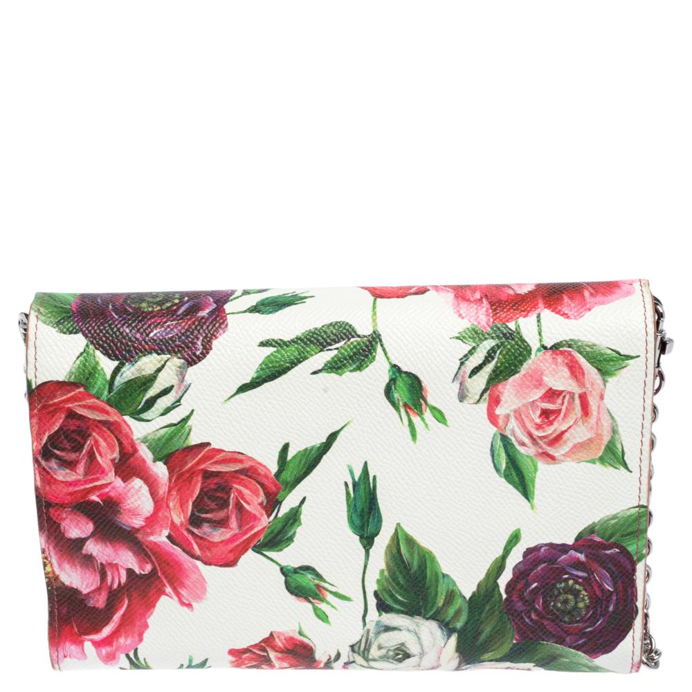 Dolce & Gabbana's wallet on chain has been crafted in Italy from peony-printed leather in a neat, structured silhouette. It is decorated with logo detail on the front flap. The wallet opens to reveal a functional interior. The chain shoulder strap