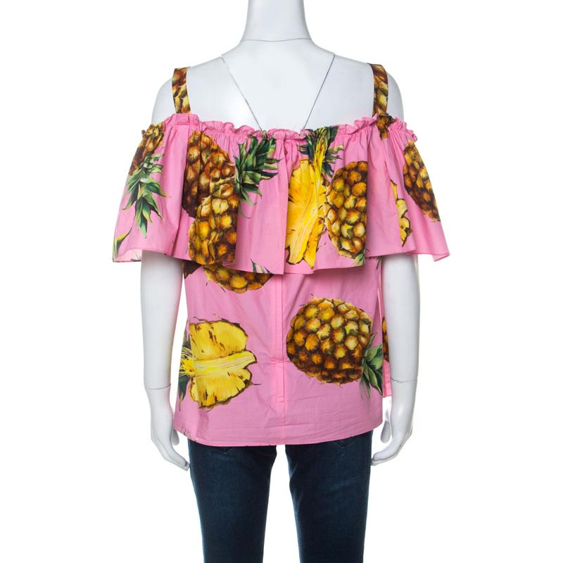 Beautifully made from cotton, this Dolce & Gabbana top is designed in a Bardot style with popping pineapple prints all over. The comfortable pink creation will surely add a tropical touch to your wardrobe.

Includes: The Luxury Closet Packaging

