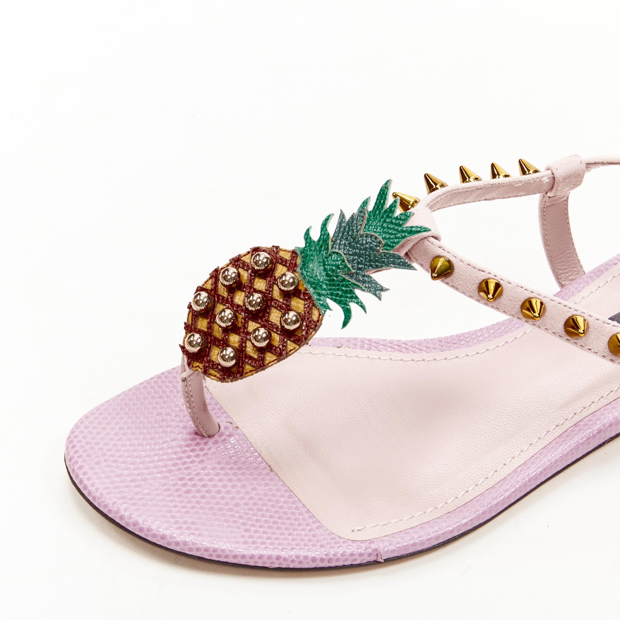 DOLCE GABBANA pink Pineapple studded thong flat sandals EU36.5 
Reference: ANWU/A00328 
Brand: Dolce Gabbana 
Material: Leather 
Color: Pink 
Pattern: Pineapple 
Closure: Buckle 
Extra Detail: Gold-tone studded hardware. 
Made in: Italy