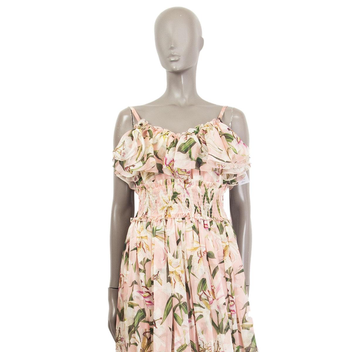 100% authentic Dolce & Gabbana floral logo print ruched long dress in pink silk (missing content tag) with multicolor print. Closes with one hook and a concealed zipper on the back and has an empire cut under the chest. Lined in rosa silk (missing