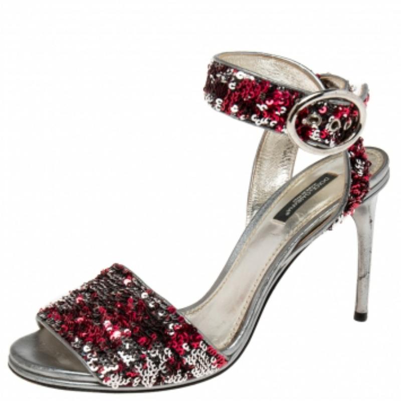 Walk with style and panache as you wear these gorgeous sandals from the House of Dolce & Gabbana. They are designed luxuriously using pink-silver leather and sequins. They exhibit open-toes, an ankle strap, and silver-tone hardware. These stunning