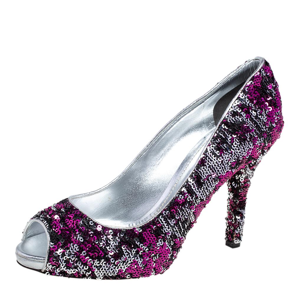 Accessorize with minimal jewelry to keep all eyes on this pair of sequins pumps. Dolce & Gabbana pumps like these are perfect to wear to special events. Make a fabulous statement in this pair of pink and silver pumps.

Includes: Info Booklet