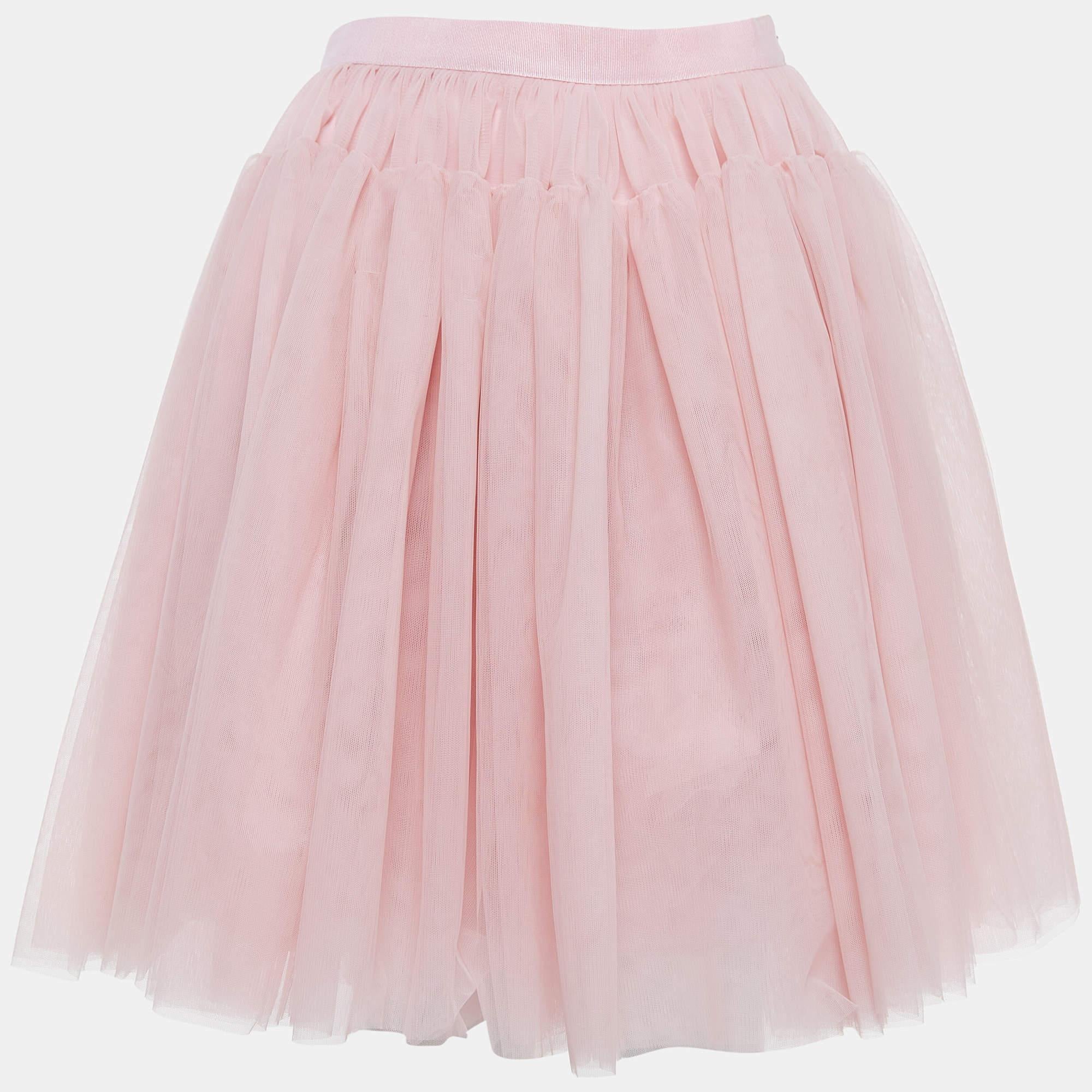 La gonna di Dolce & Gabbana è un capo affascinante ed elegante. È realizzato con un tessuto di tulle rosa che aggiunge un tocco giocoso. Questa simpatica gonna è un'aggiunta deliziosa e alla moda al guardaroba dei più piccoli.