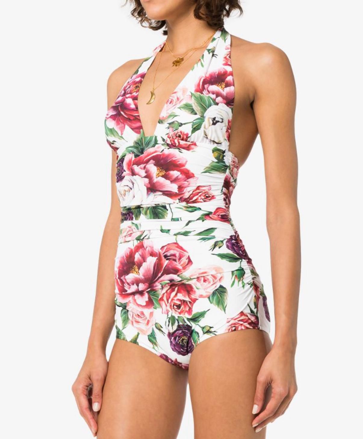 Stunning Dolce & Gabbana one-piece swimsuit which is draped on the sides is made from a precious fabric in the romantic PEONY ROSE print and has an extraordinarily sophisticated look. 
Perfect for both the poolside and as a top for a cocktail party.