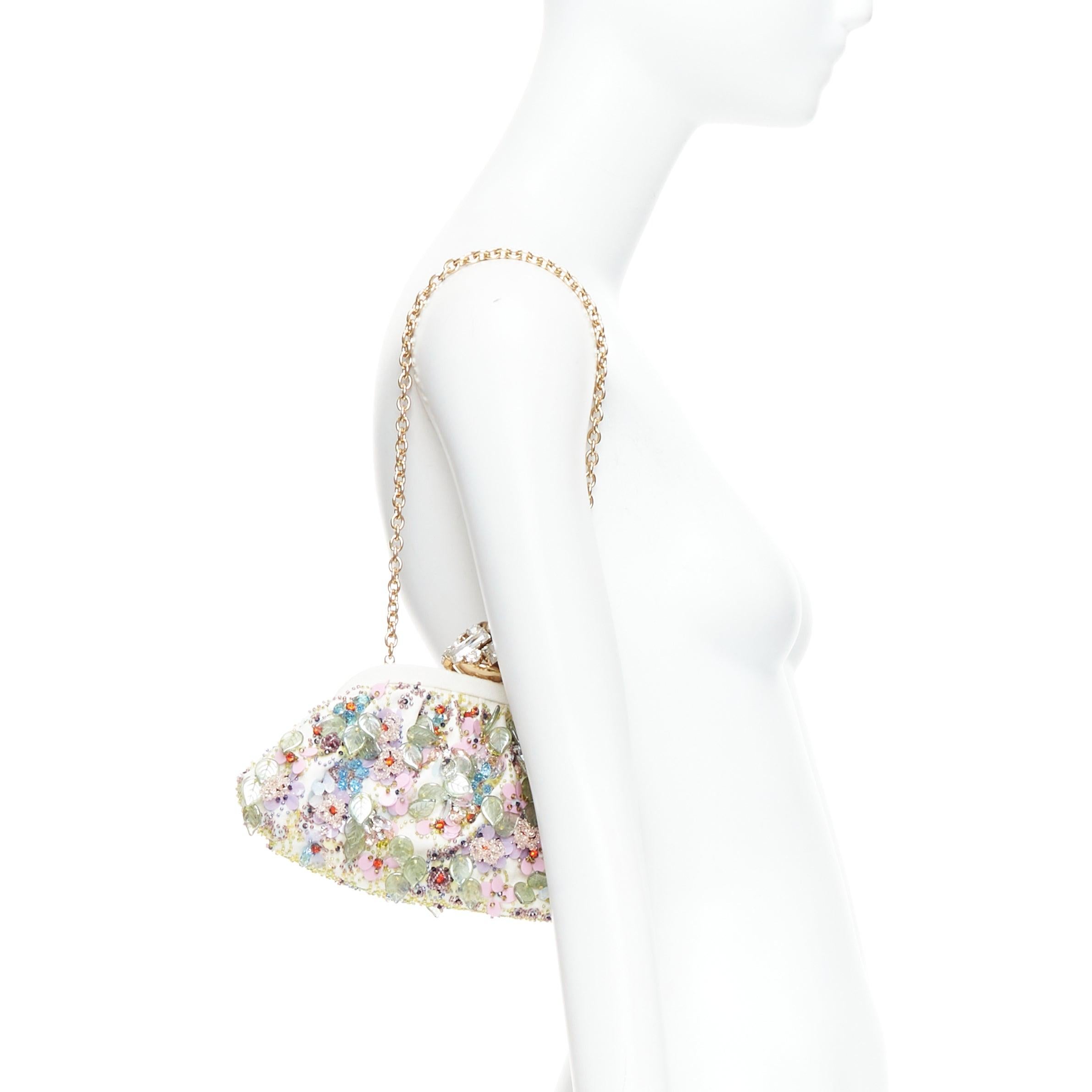 DOLCE GABBANA Pochette cream colorful crystal embellished lock frame clutch bag
Reference: TGAS/E00464
Brand: Dolce Gabbana
Designer: Domenico Dolce and Stefano Gabbana
Model: Pochette
Material: Fabric
Color: Cream, Multicolour
Pattern: