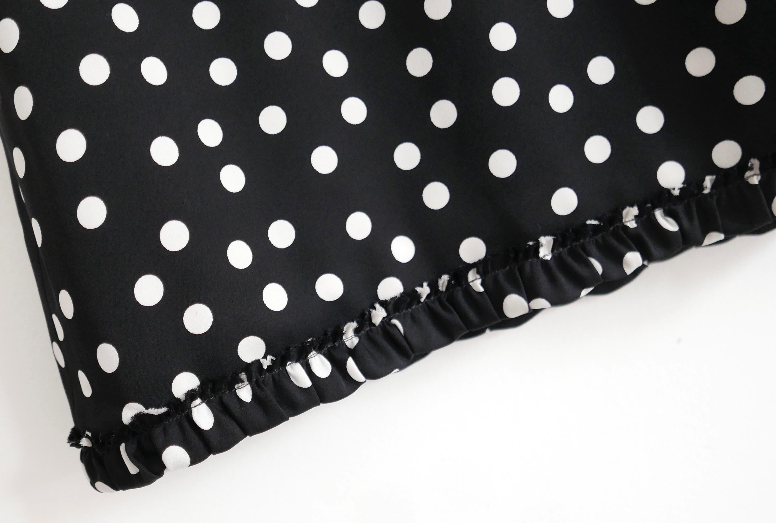 Gorgeous Dolce & Gabbana polka dot silk skirt. Bought for £1500 and worn once. Made from super soft black and white polka dot printed silk/elastane, it has frilled hem, wide elasticated waistband and silk/elastane fully stitched lining. Size