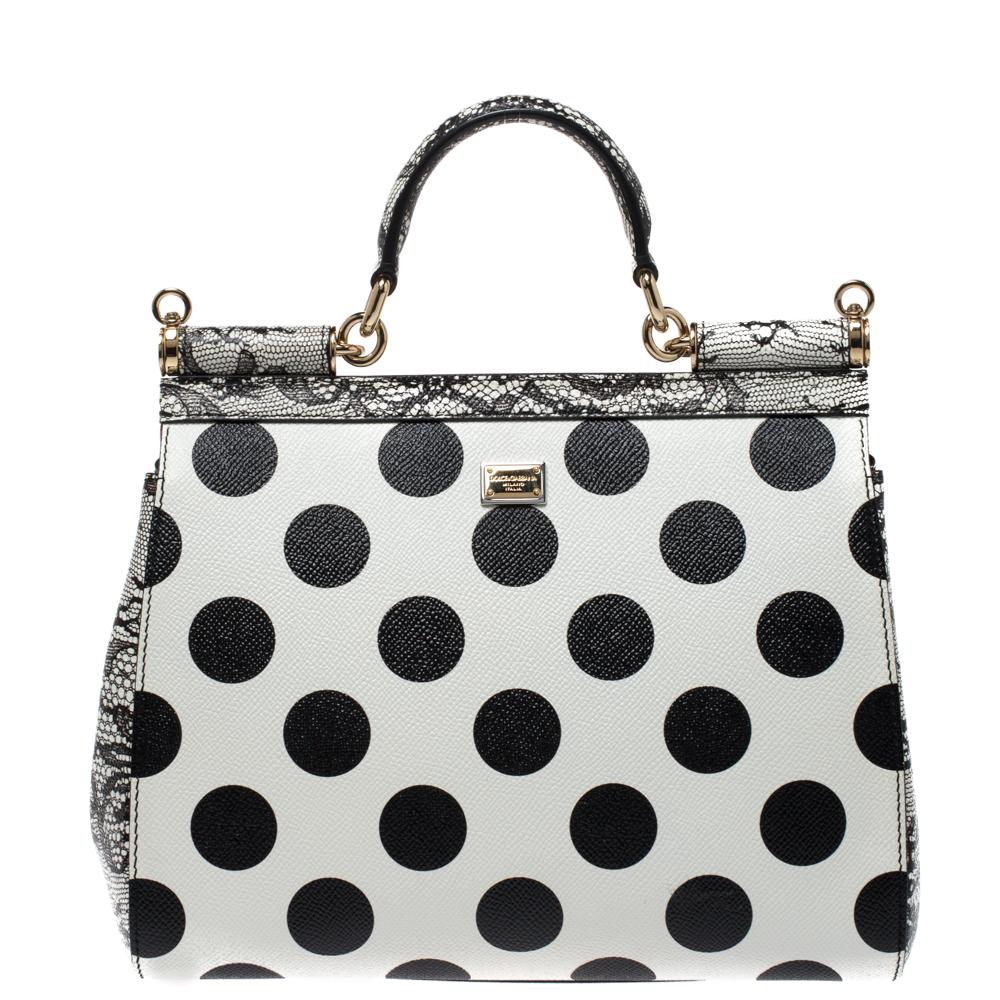 Diese wunderschöne schwarz-weiße Miss Sicily Schultertasche von Dolce & Gabbana ist eine Handtasche:: die von Frauen auf der ganzen Welt begehrt wird. Sie hat ein gut strukturiertes Design und eine Klappe:: die sich zu einem Fach mit Stofffutter
