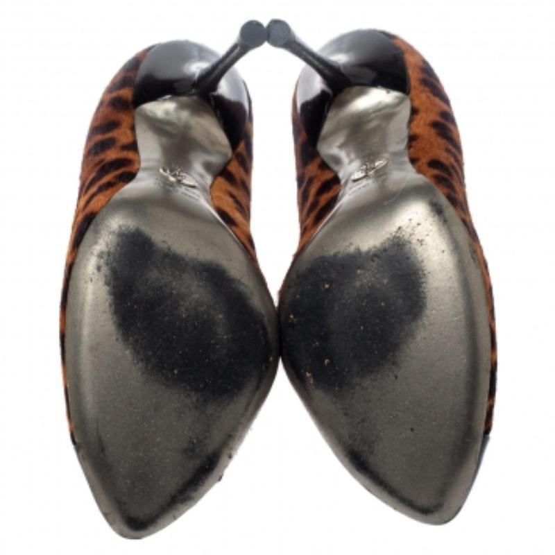These pumps from Dolce & Gabbana are meant for seasons of comfort and style. Crafted from pony hair and patent leather, they feature lace-up details, black cap toes, and 11 cm heels meant to elevate you with ease. These pumps are a must-have.