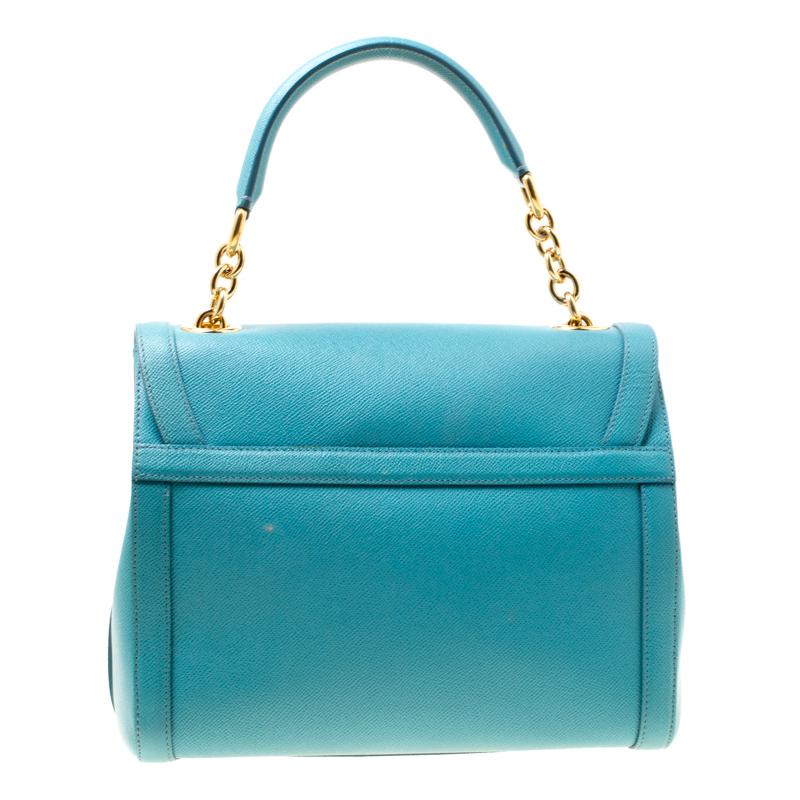 The style of this Dolce & Gabbana bag is delighting which makes the creation worthy of being owned. It has been crafted from powder blue leather and styled with a turn-lock padlock detailed on the flap. The bag is finished with a top handle and a