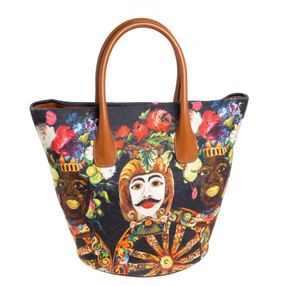 Add some magic to your everyday attire with this super stylish and classy shopper tote from Dolce & Gabbana. Crafted from multicolor printed canvas, it features a well-structured silhouette that is assisted by a sturdy bottom with metal studs and