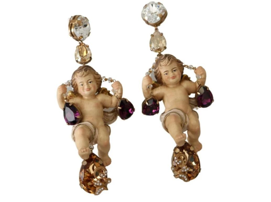 Gorgeous brand new with tags, 100% Authentic Dolce & Gabbana earrings.




Model: Clip On Dangling
Motive: PUPPI Sicily
Material: 30% Crystal, 40% Wood, 30% Brass

Color: Gold, beige
Crystals: Gold, purple, clear
Logo details
Made in Italy


Length: