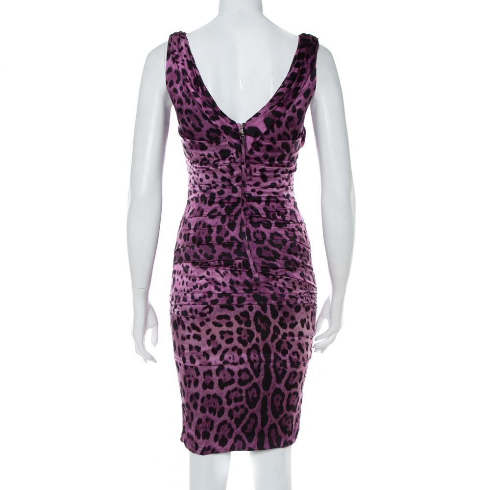 This sleeveless dress from Dolce & Gabbana is sure to help you make an impression! It features the signature animal print all over and ruched detailing. A square-cut neckline that forms a V-cut down the back and a zip closure complete this wonderful