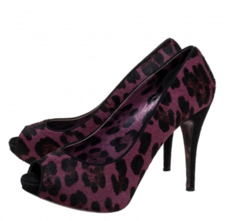 Dolce & Gabbana impresses us with these fabulous purple pumps that come crafted from leopard printed calf hair and suede in a peep-toe silhouette. They are styled with concealed platforms and 12 cm heels and equipped with comfortable leather-lined
