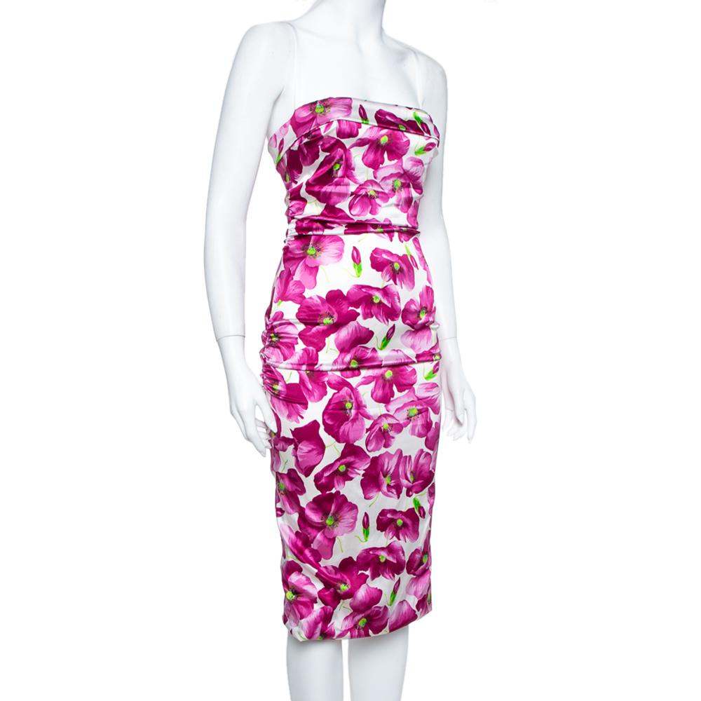 Dolce & Gabbana's midi dress is decorated with blooms, making the dress look vibrant and chic. Cut from a silk blend, the creation features ruched details on the sides that add to the dress's flattering fit. Complement the pretty neckline with a