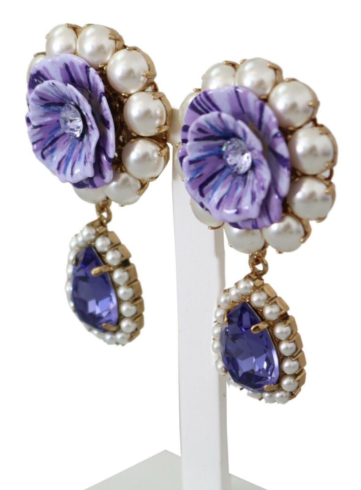  Gorgeous brand new with tags, 100% Authentic Dolce & Gabbana Clip-on earrings. Emblazoned with floral appliques. Inlaid with purple and white crystals.




Model: Clip-on, drop
Motive: Floral
Material: Brass, crystals, resin

Color: Gold

Crystal: