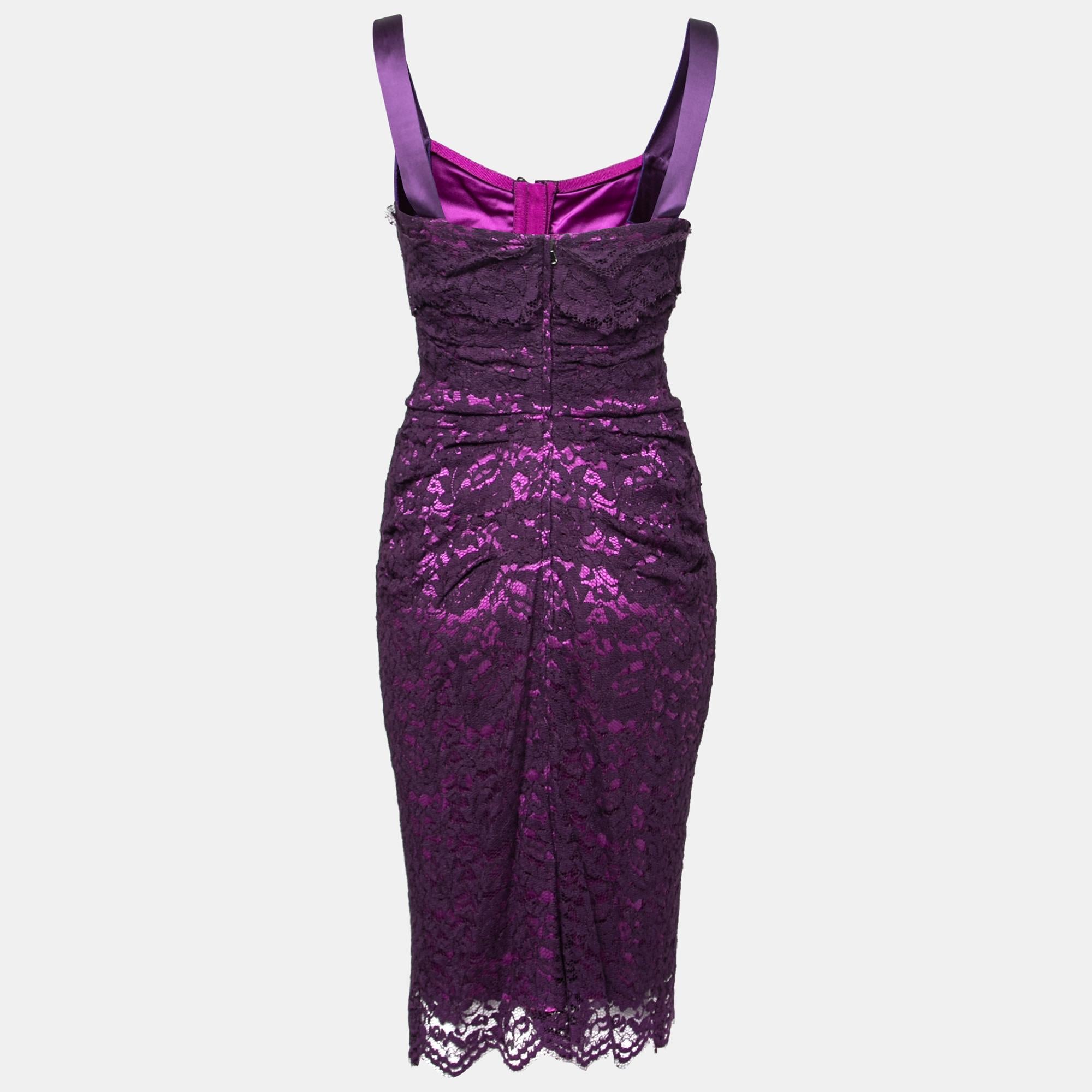 With this lovely purple dress, Dolce & Gabbana makes sure that you always have the best outfit to flaunt your feminal beauty and grace in. Defined with lacy edgings and a sleek silhouette, this sleeveless dress emphasizes your beauty most elegantly.
