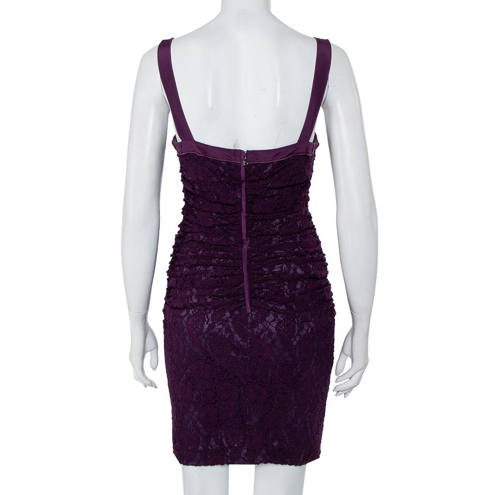Chic, and stylish, this Dolce & Gabbana dress is an example of the label's feminine sensibilities. The creation is overlaid with dainty lace in a purple hue and comes with ruched details. Style the dress with pointed pumps for an elegant look.

