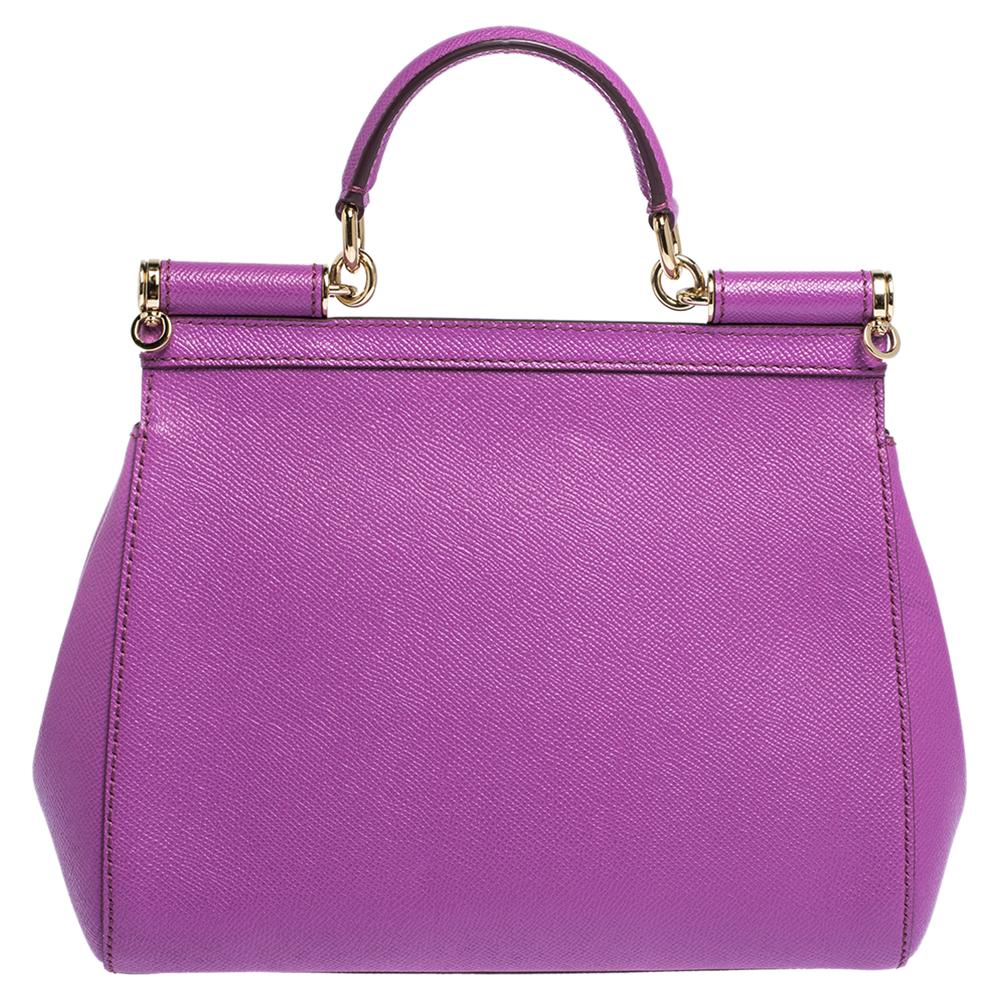 This gorgeous purple Miss Sicily bag from Dolce & Gabbana is a handbag coveted by women around the world. It has a well-structured leather body and a flap that opens to an interior with enough space to fit your essentials. The bag comes with a top