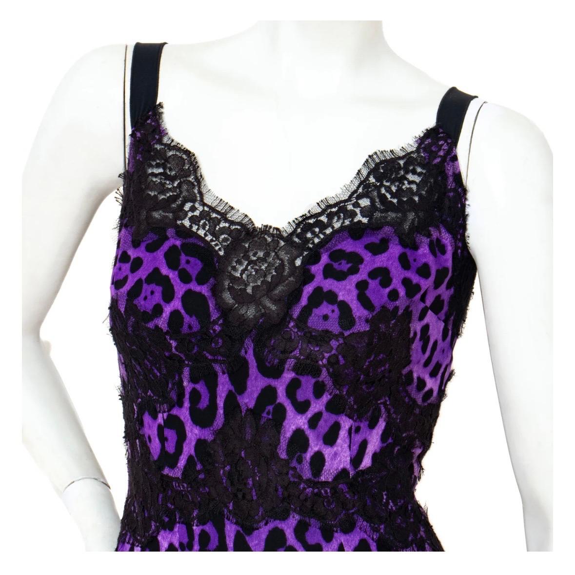 Purple leopard print dress by Dolce & Gabbana
Period: 2000–2009 
Made in Italy
Sleeveless slip dress style
Black lace detailing and trim 
Wide straps 
Back zipper closure 
Back slit on skirt
Fitted silhouette; stretchy 
Materials: 66% silk, 24%