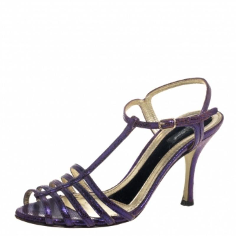 Crafted from lizard-embossed leather in a purple hue, these Dolce & Gabbana sandals are glamourous and timeless. They come in a strappy layout, open toes, and t-straps. Elevated on 8.5 cm heels, they will amp up your outfit instantly.