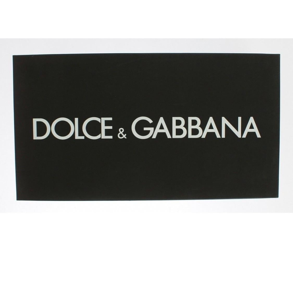 DOLCE & GABBANA

Gorgeous brand new with tags, 100%
Authentic Dolce & Gabbana PUMP lace
shoes with jewel detail on the top.
Model: Pumps

Collection: Rainbow collection
Taormina lace

Color: Purple 

Crystals: Purple and gray 

Material: 30% Cotton,