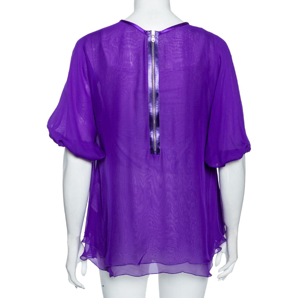 This top from Dolce & Gabbana will definitely highlight your style for the day. Stitched using purple silk material with chiffon layering, this top adds a touch of finesse to its look. Style this graceful top with your trousers and heels to look