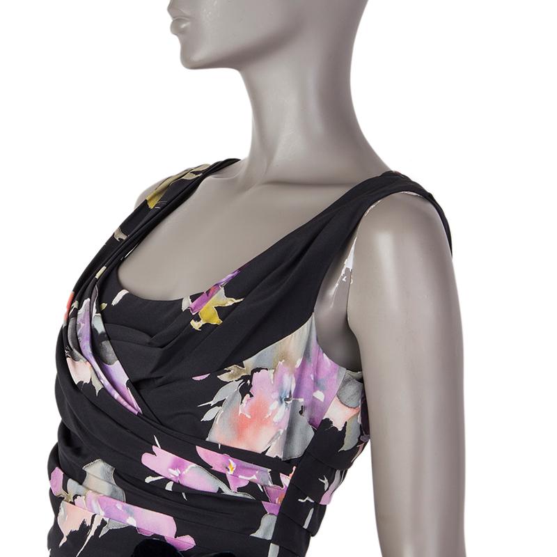 Dolce & Gabbana leopard and flower print draped sheath dress in black, purple, fuchsia, rose, grey, mint, light blue, and white silk (91%) and elastane (9%). With a blue velvet flower applique on the left side. Closes with a concealed zipper and a