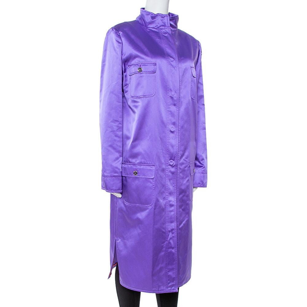 This fine purple coat from Dolce & Gabbana deserves a special place in your closet. It displays front button closure and long sleeves. Made entirely from soft silk, this beautiful coat can be layered over sweaters for a comfortable and stylish