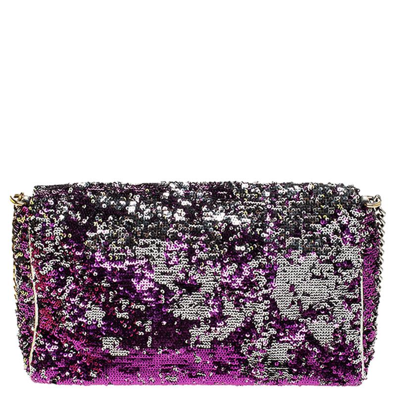 Stylish and handy, Miss Charles shoulder bag from Dolce & Gabbana is crafted from purple/silver sequins. The bag comes with a chain-link handle and a spacious satin-lined interior that houses a zipped pocket. Sophisticated and stylish this bag is