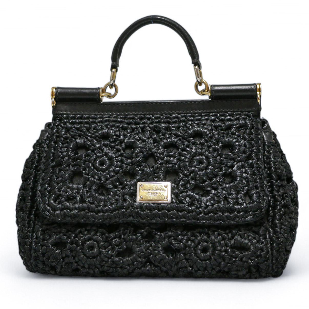 Beautiful DOLCE & GABBANA Sicily elongated bag in crocheted  black raffia
Condition : very good
Made in Italy
Material : raffia, calf leather inserts
Interior : leopard print textile lining with a pocket
Colour: black
Dimensions: 25 x 17 x 9