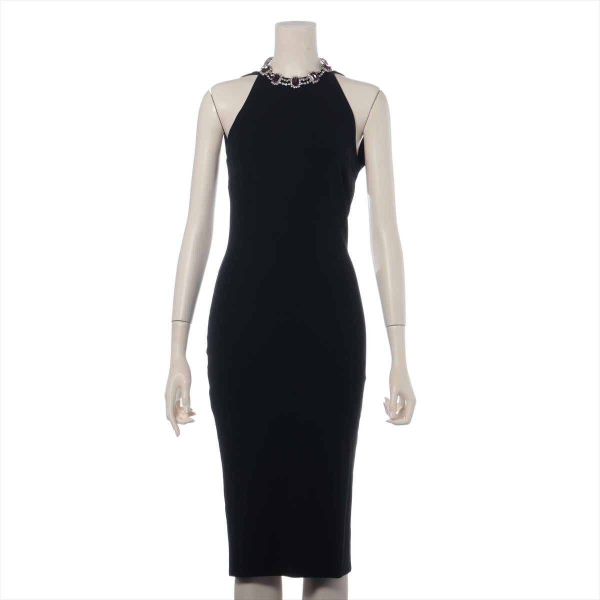 The Dolce & Gabbana Rayon Sleeveless Dress in black is a masterpiece of elegance and sophistication. Crafted from luxurious rayon, the dress features a sleek and flattering silhouette. The design is elevated by an exquisite rhinestone necklace